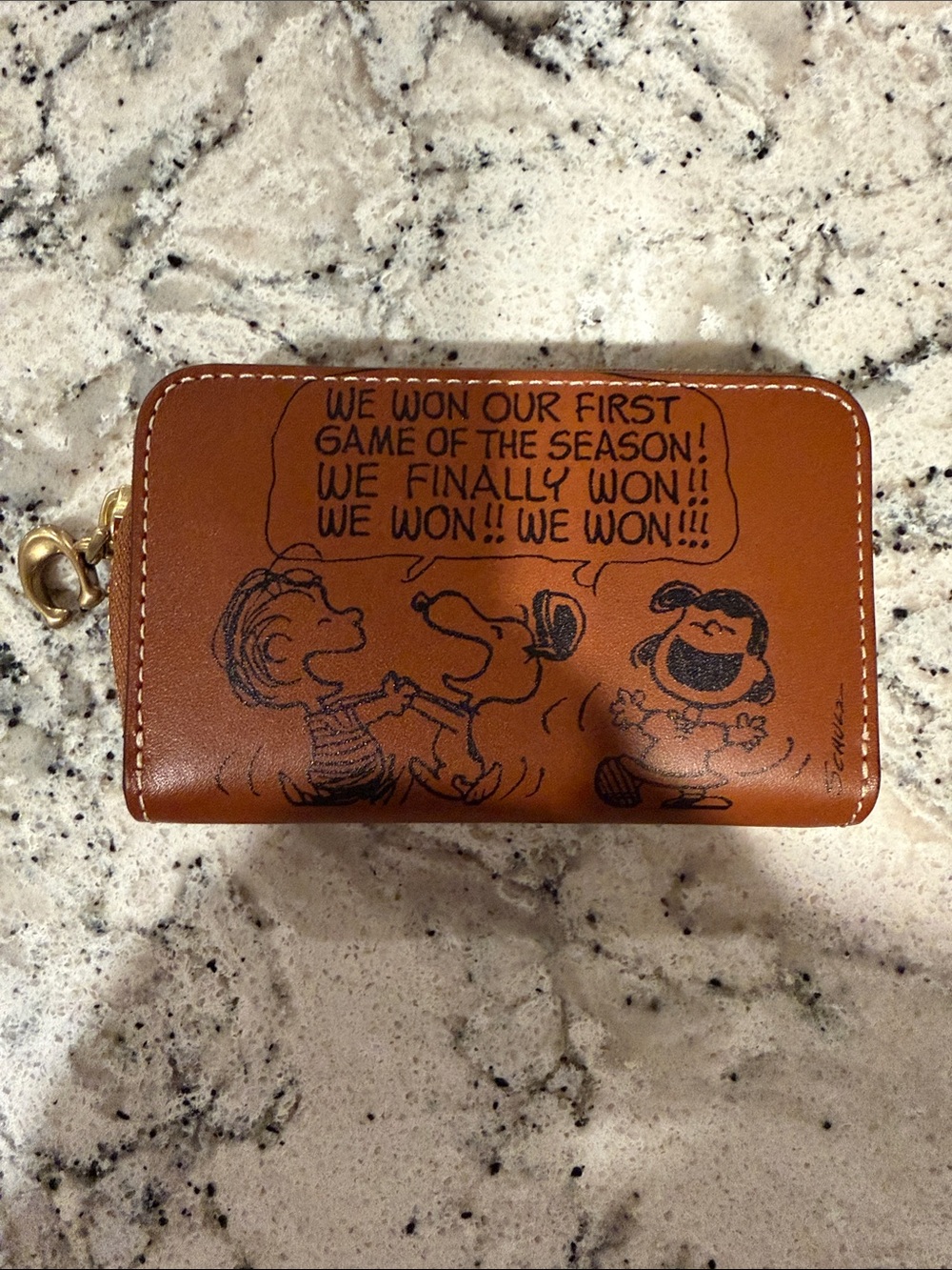 Coach “peanuts” zip around card wallet